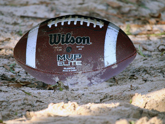 Upside Football in sand