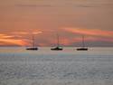 Three Boats At Sunset