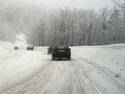 Car Tracks on Snowy Road